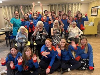 Girl Guides join Angmering care home residents for a journey into Christmas past