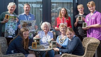 Generations unite at Wantage care home to build insect hotel