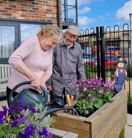 Residents gardening at Dashwood Manor